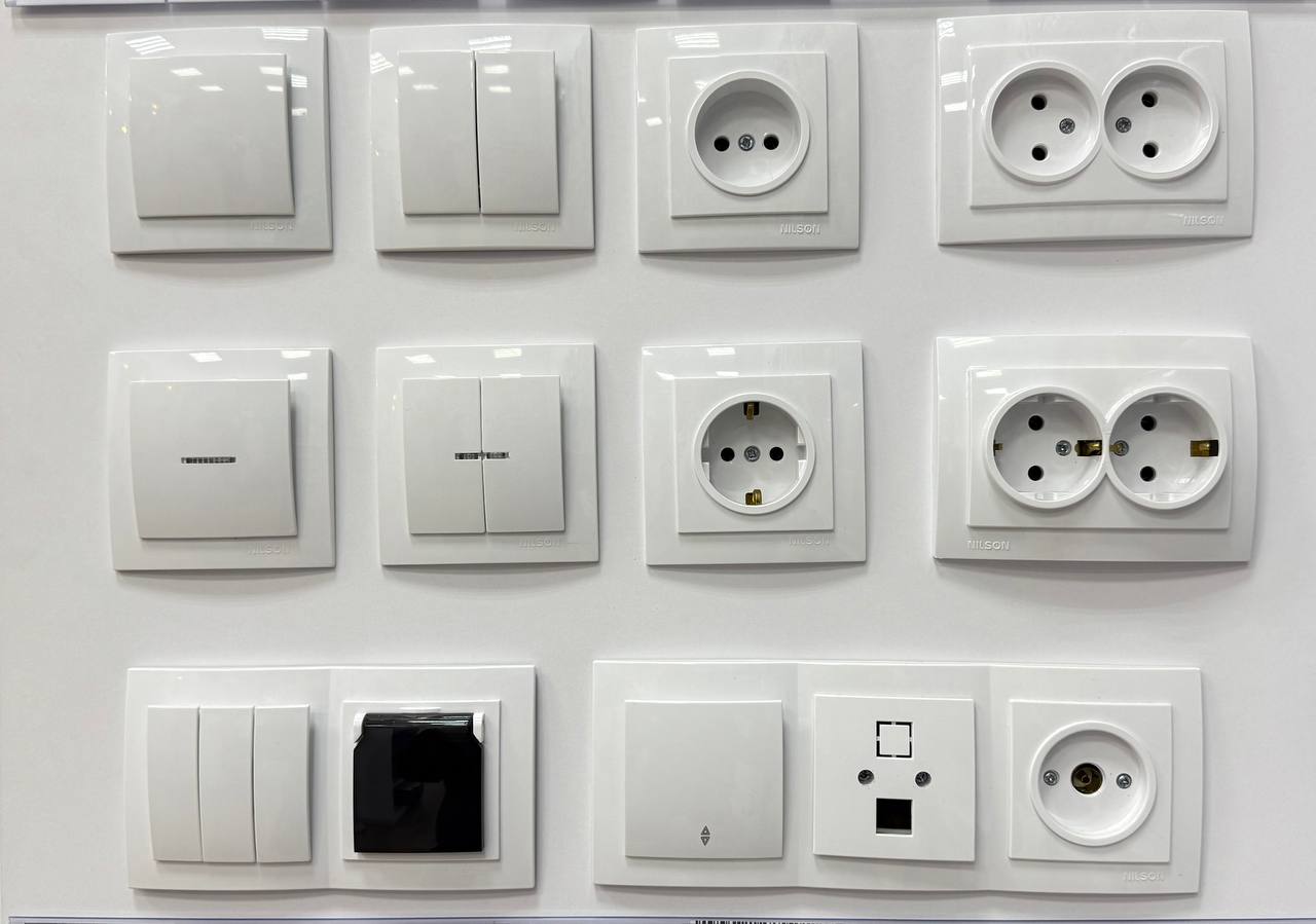 Фірмова електрофурнітура Nilson — вимикачі, розетки та роз’єми у магазині Лампочка